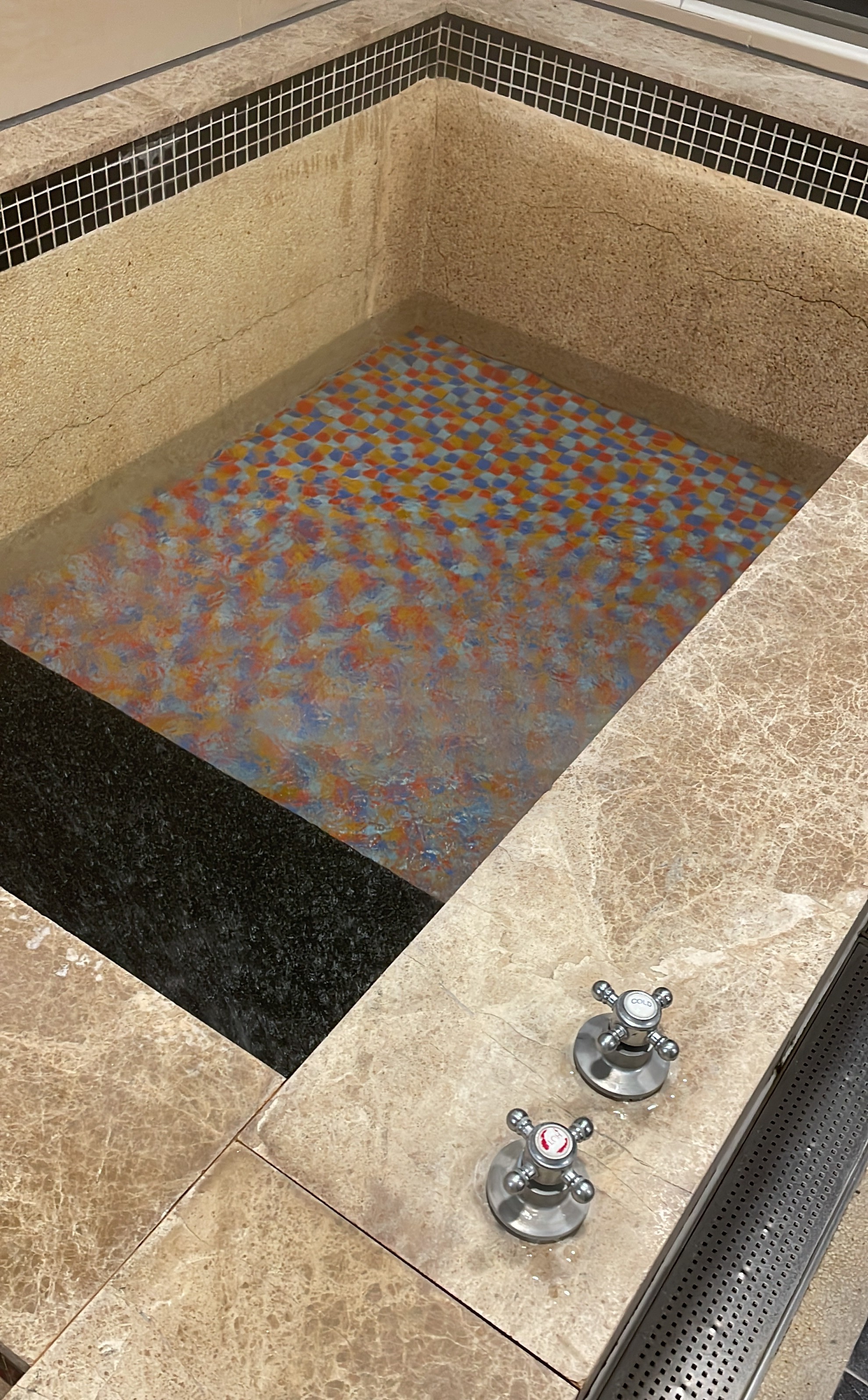 Mosaic tile and cross handle faucet