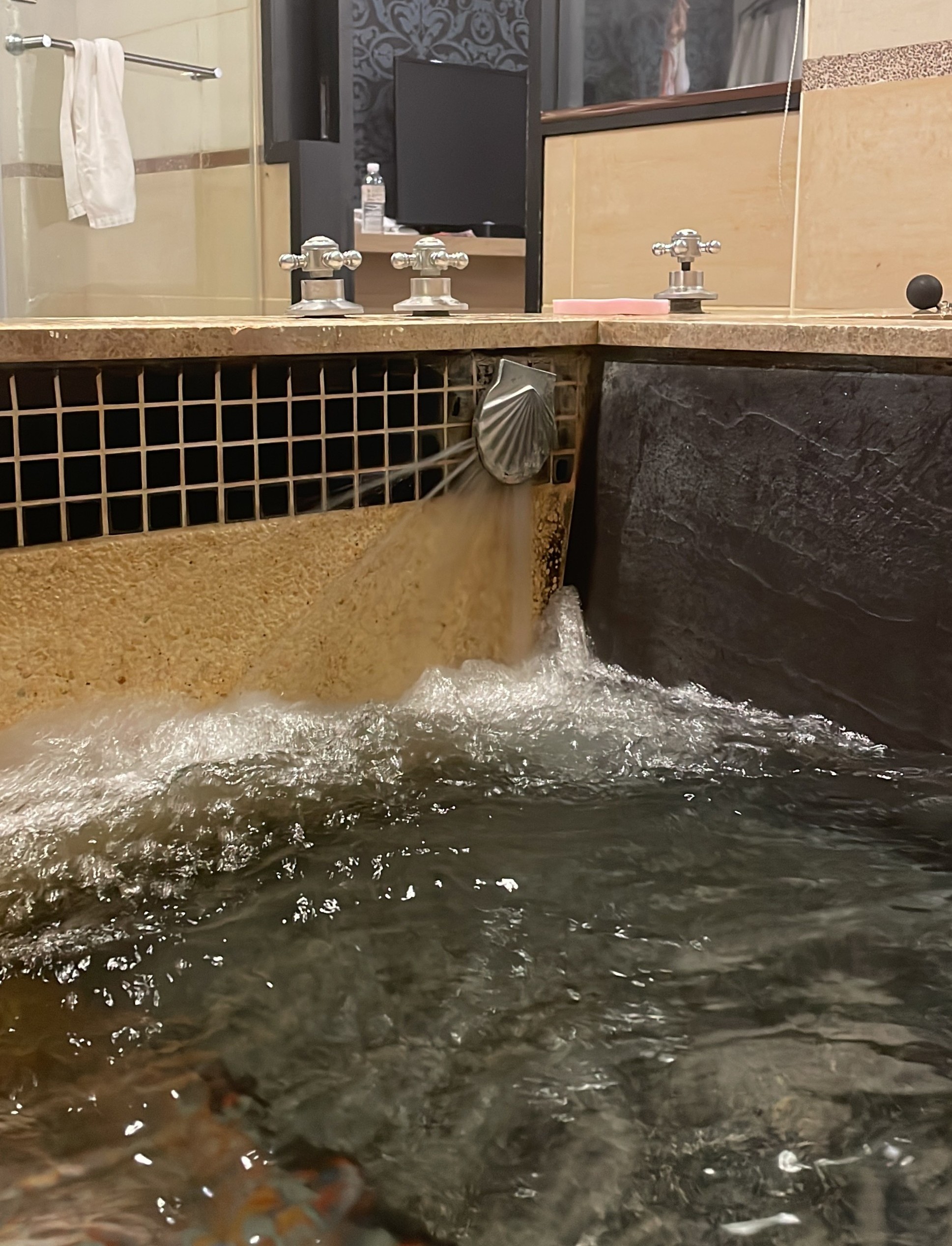 Water filling the tub